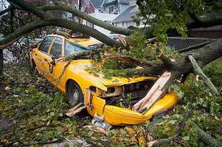 "NYC taxi cab crushed in Ditmas Park" by Adrian Kinloch via Flickr (Creative Commons License)